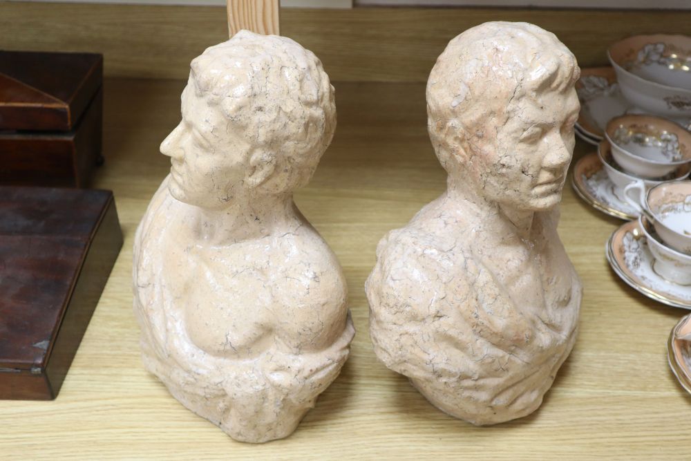 Two pink glass ceramic busts, tallest 33cm